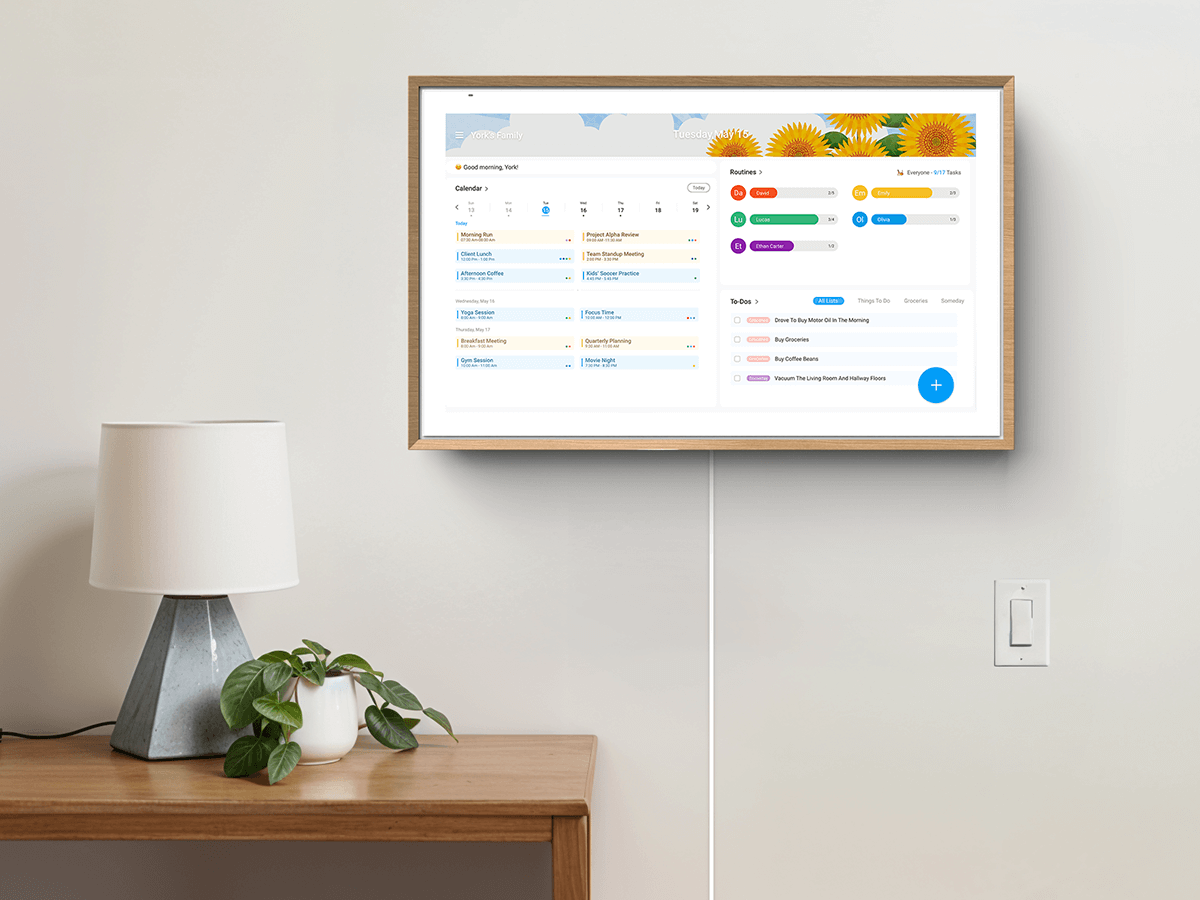 Wall-mounted smart home display showing family calendar and tasks