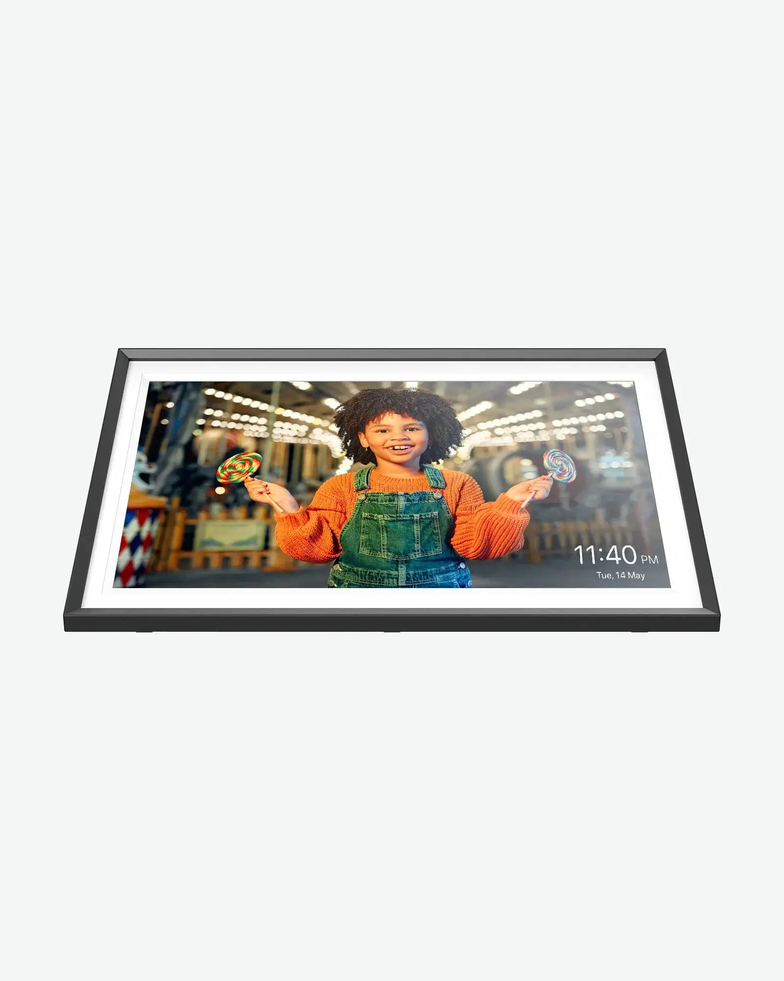 Apolosign 15.6 inch digital photo frame displays smiling girl holding lollipops, with time and date.