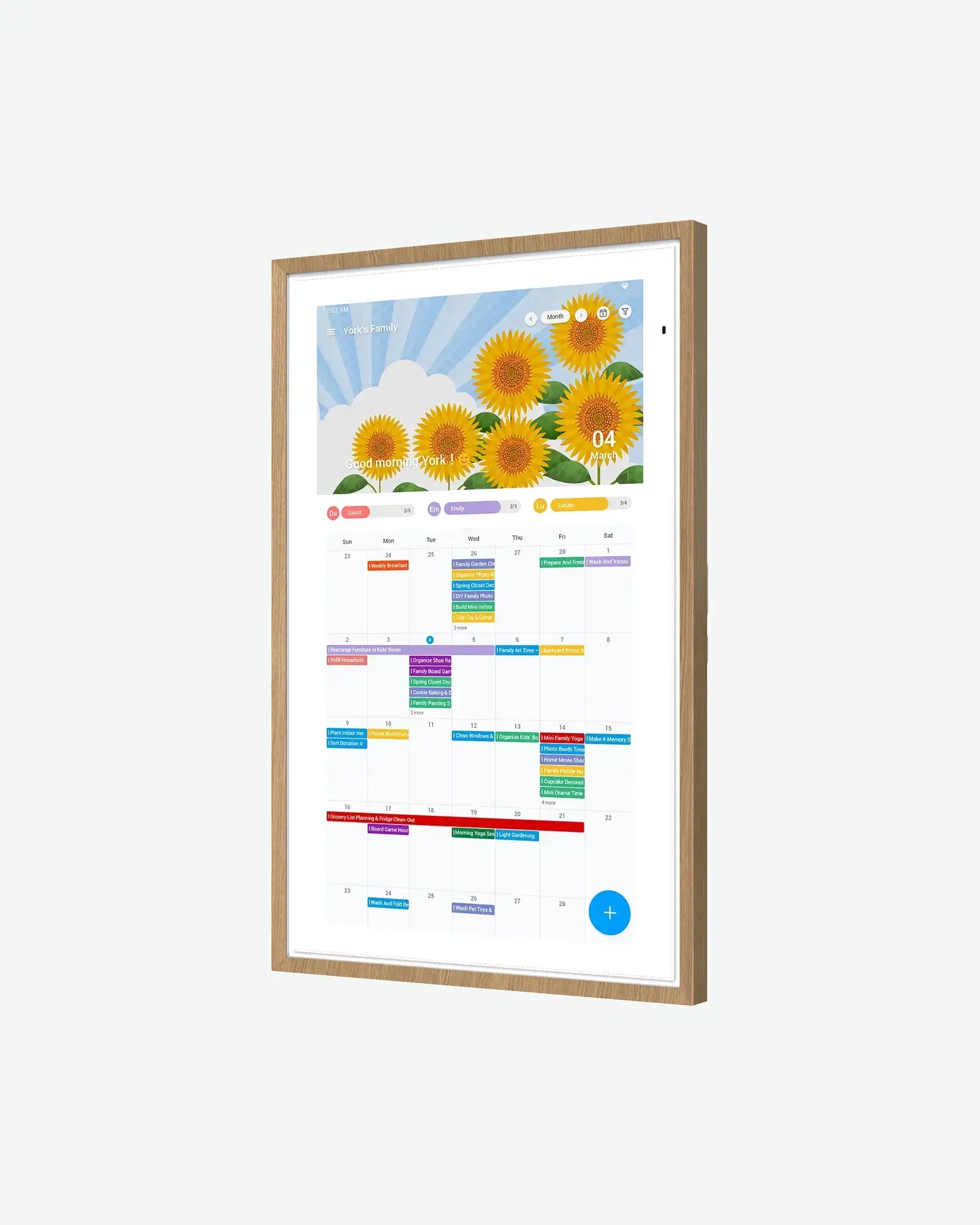 21.5 inch smart digital calendar with oak frame, displaying sunflower screensaver and colorful event schedule.