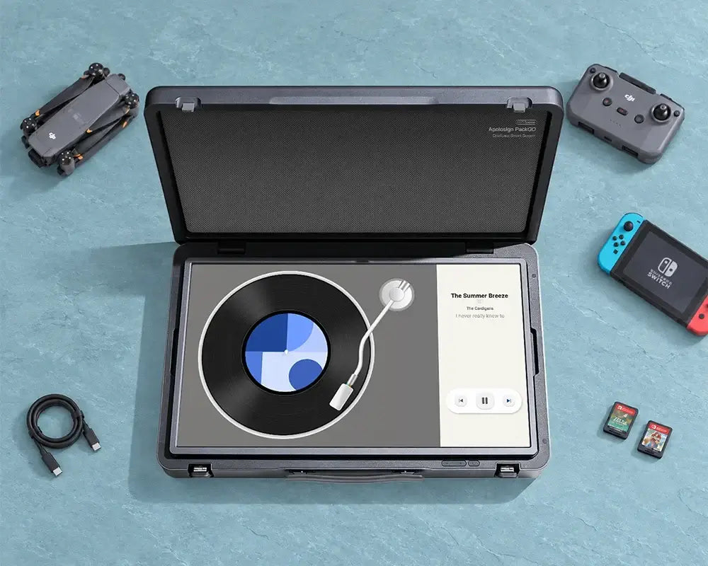 Apolosign PackGo briefcase portable TV displaying a music player, with HDMI connectivity for big-screen gaming on the go.