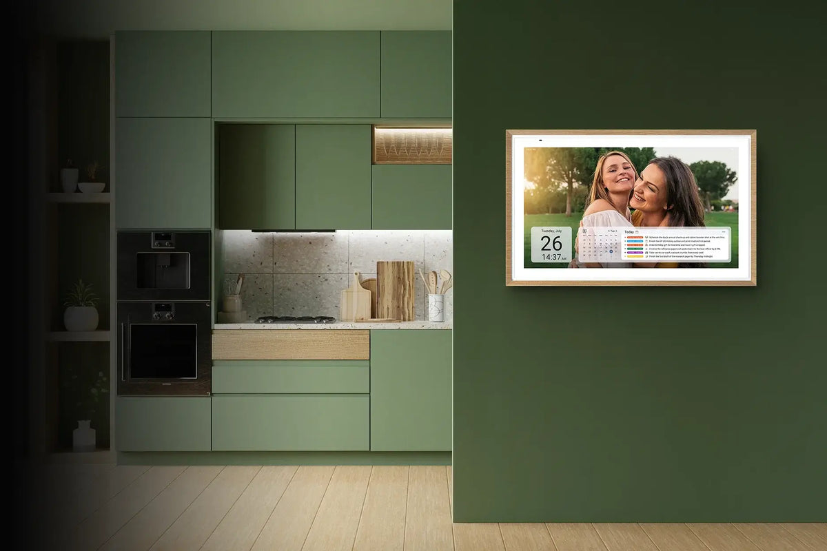 Wall-mounted Digital Calendar displaying family photos and schedules in a modern kitchen.